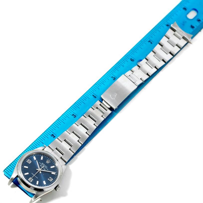 The image shows a Rolex Air-King 14000 Men's Stainless Steel Blue Dial 14000 Men's Stainless Steel Blue Dial watch positioned next to a ruler, displaying the face and full bracelet.
