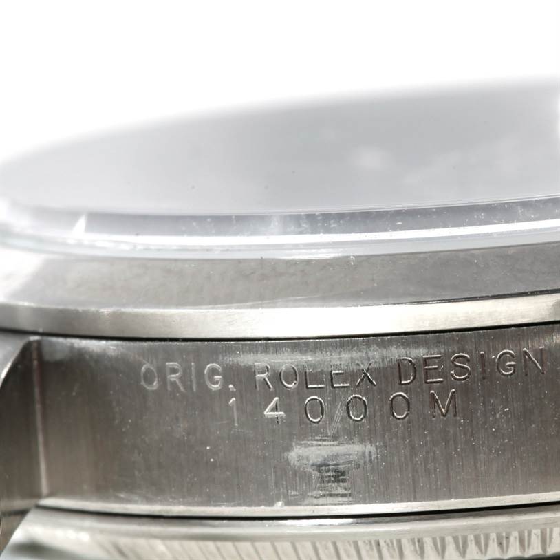 This close-up image shows the side of the case and bezel of a Rolex Air-King 14000 Men's Stainless Steel Blue Dial 14000 Men's Stainless Steel Blue Dial watch, highlighting the engraved model number "14000M".