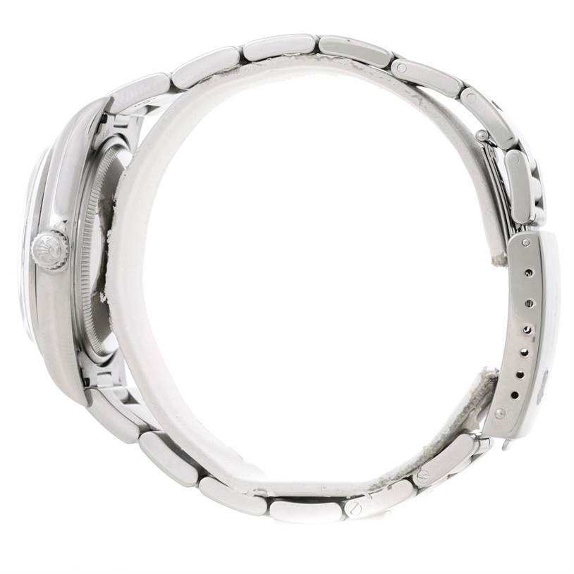 The Rolex Air-King 14000 Men's Stainless Steel Blue Dial 14000 Men's Stainless Steel Blue Dial watch is shown from a side view, displaying the bracelet, clasp, and crown.