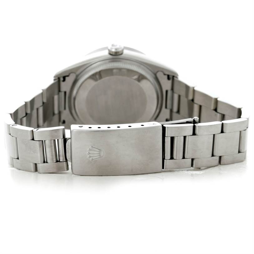 The image shows the back of the Rolex Air-King 14010 Men's Stainless Steel Blue Dial 14010 Men's Stainless Steel Blue Dial watch, including the case back and the bracelet with the clasp open.