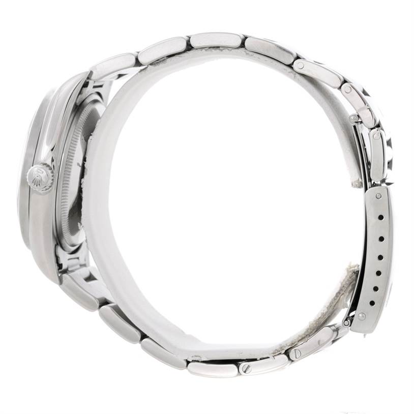 Side view of the Rolex Air-King 14010 Men's Stainless Steel Blue Dial 14010 Men's Stainless Steel Blue Dial watch, showcasing the band, case, crown, and part of the clasp.