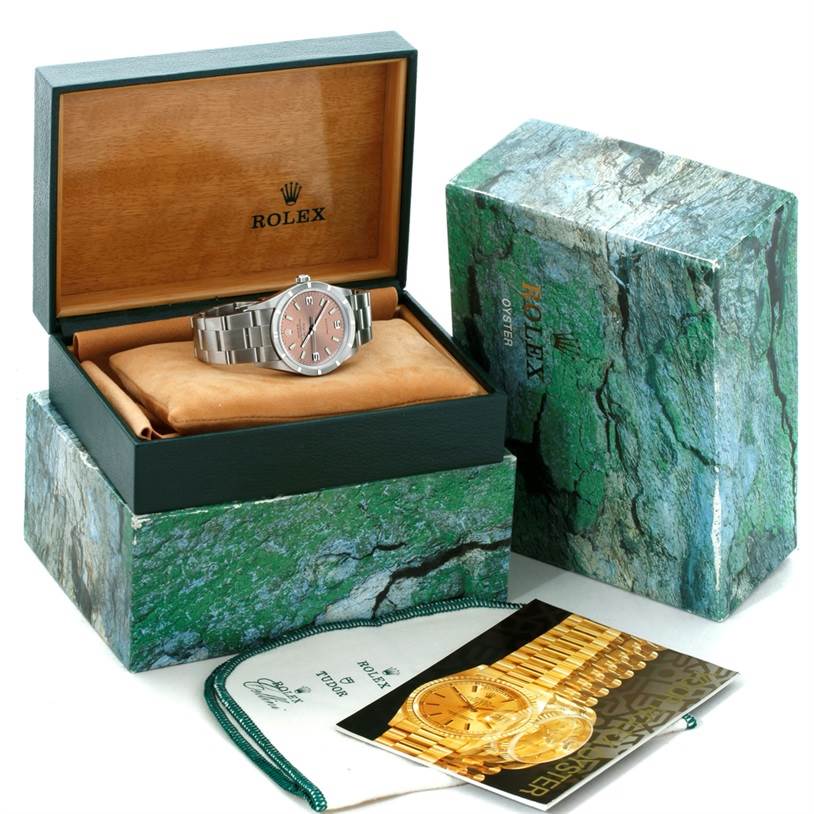 The image shows a Rolex Air-King 14010 Men's Stainless Steel Pink Dial 14010 Men's Stainless Steel Pink Dial watch in its open box with the outer box and manuals.