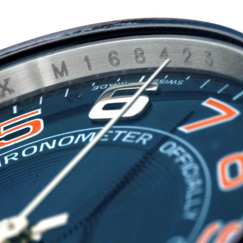 This close-up angle showcases part of the Rolex Air-King 114200 Men's Stainless Steel Blue Dial 114200 Men's Stainless Steel Blue Dial watch's dial, including the numerals, markers, and the "Chronometer" text.