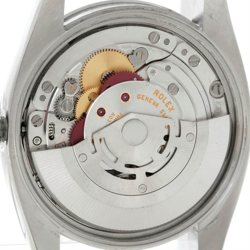 The image shows the inner mechanism and movement of the Rolex Air-King 114200 Men's Stainless Steel Blue Dial 114200 Men's Stainless Steel Blue Dial watch viewed from the back.