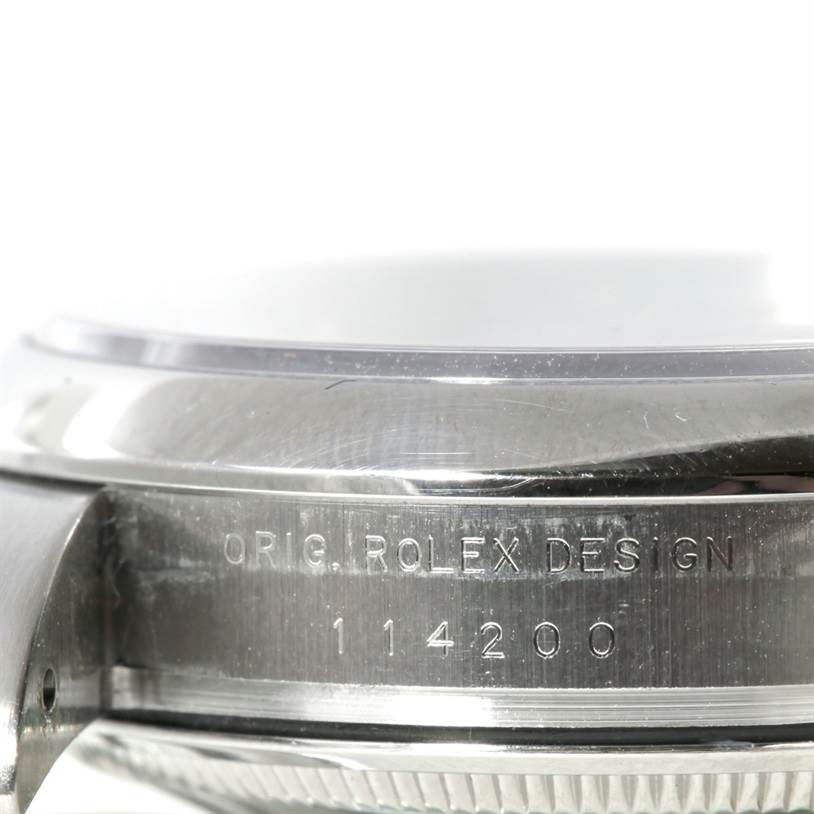 This close-up image shows the side engraving and part of the case for a Rolex Air-King 114200 Men's Stainless Steel Blue Dial 114200 Men's Stainless Steel Blue Dial model watch.