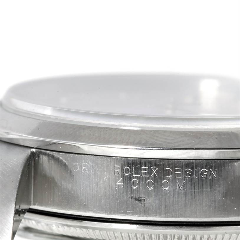 The image shows a close-up side angle of a Rolex Air-King 14000 Men's Stainless Steel Silver Dial 14000 Men's Stainless Steel Silver Dial watch case with the "Rolex Design" engraving.