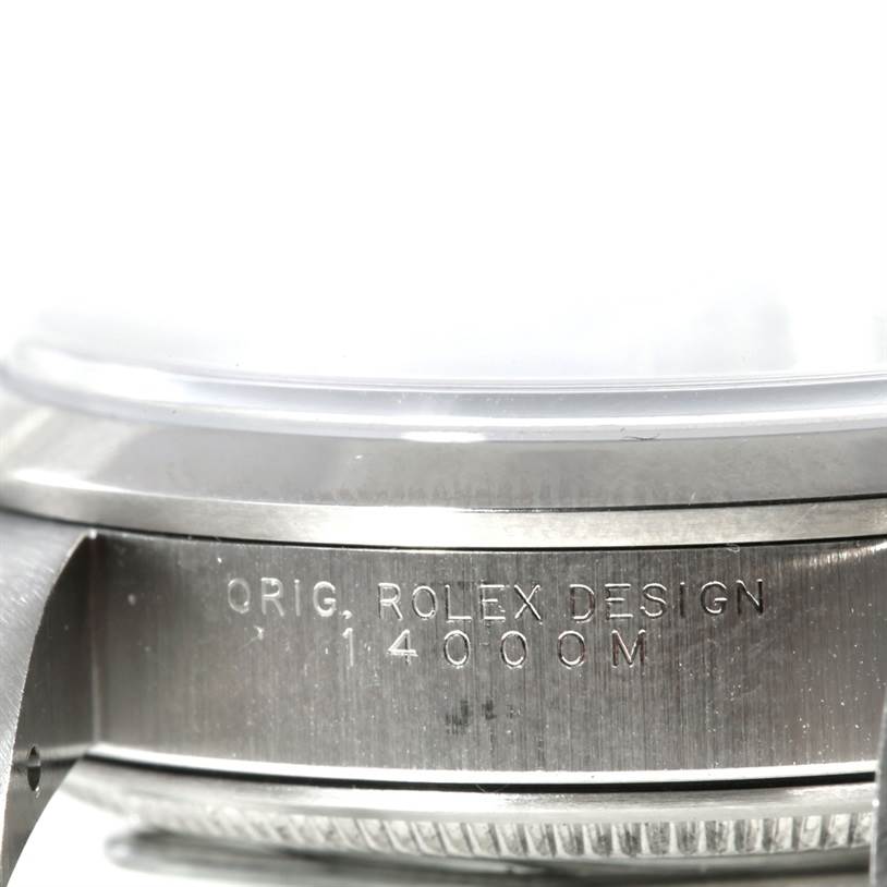 The image shows a close-up angle of the side casing of a Rolex Air-King 14000 Men's Stainless Steel Blue Dial 14000 Men's Stainless Steel Blue Dial watch with the model number 14000M engraved.