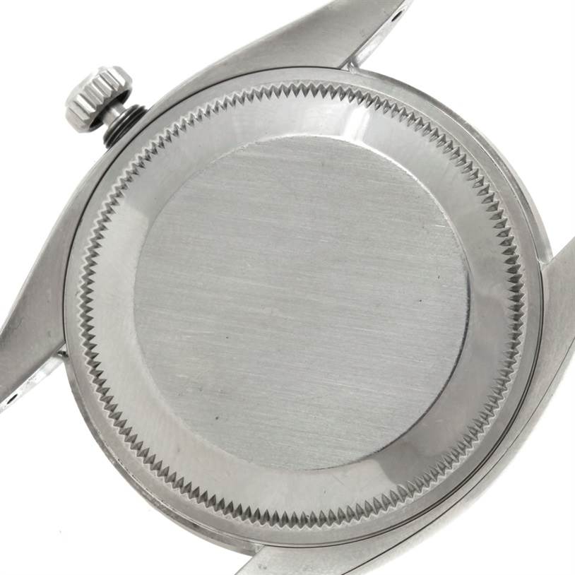 This image shows the back case and crown of a Rolex Air-King 114200 Men's Stainless Steel Blue Dial 114200 Men's Stainless Steel Blue Dial watch.