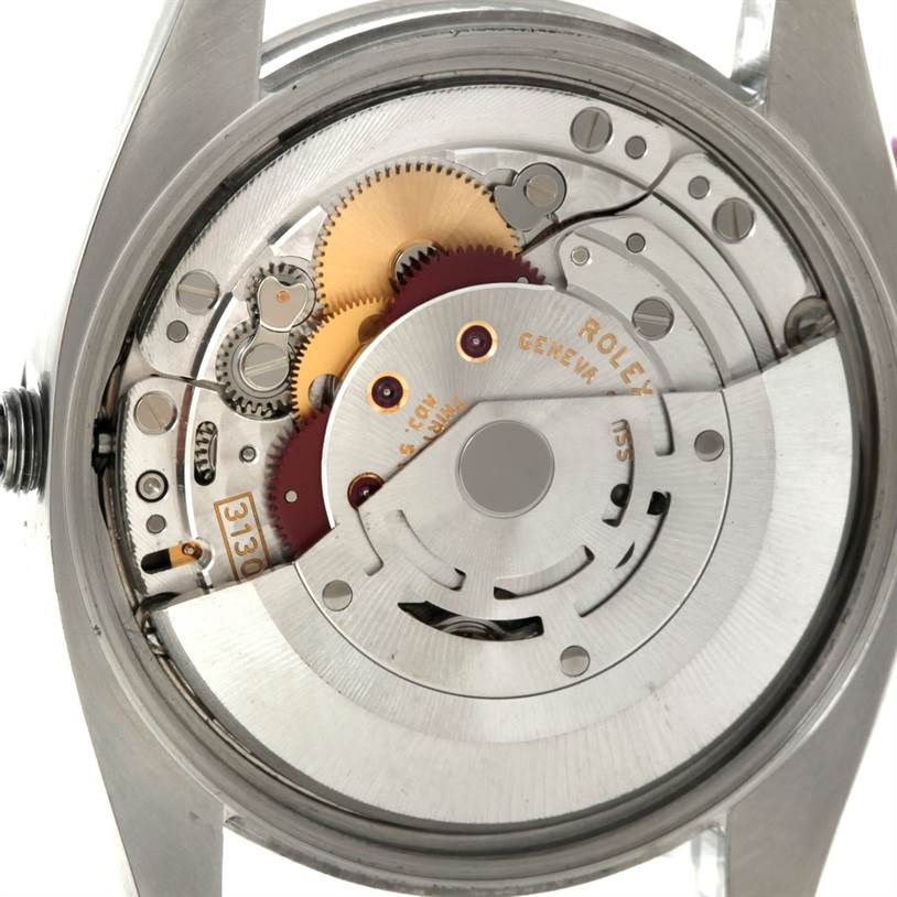 This image shows the internal mechanical movement of a Rolex Air-King 114200 Men's Stainless Steel Blue Dial 114200 Men's Stainless Steel Blue Dial watch from a rear angle.