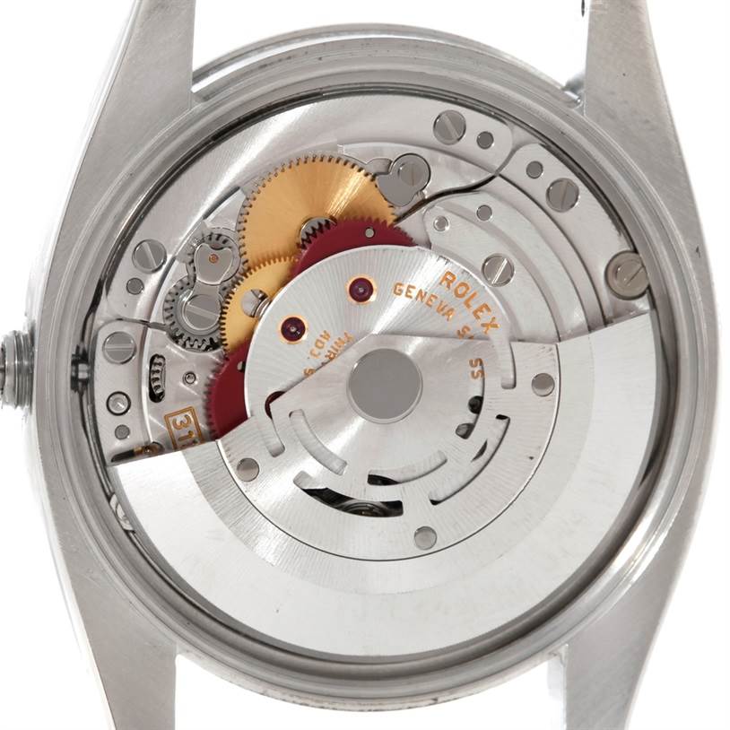 The image shows the interior mechanism and movement parts of the Rolex Air-King 114200 Men's Stainless Steel Silver Dial 114200 Men's Stainless Steel Silver Dial watch from a back view.