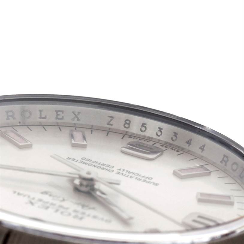 This image shows a close-up of the bezel and dial of a Rolex Air-King 114200 Men's Stainless Steel Silver Dial 114200 Men's Stainless Steel Silver Dial watch, viewed from a side angle.