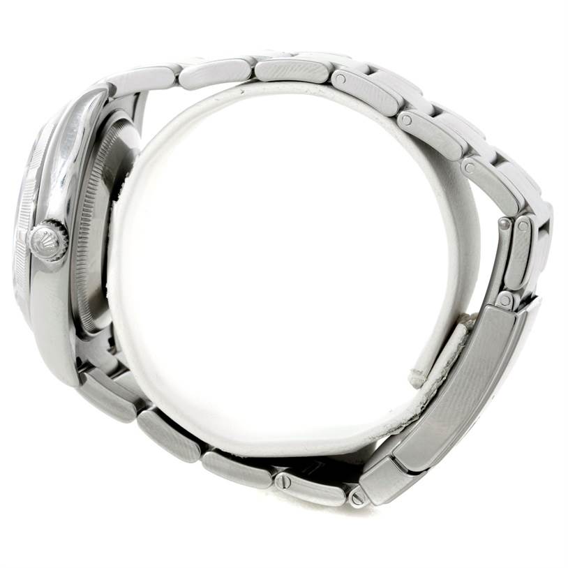 The image shows a side view of a Rolex Air-King 114200 Men's Stainless Steel Silver Dial 114200 Men's Stainless Steel Silver Dial watch, highlighting the case, crown, and bracelet.