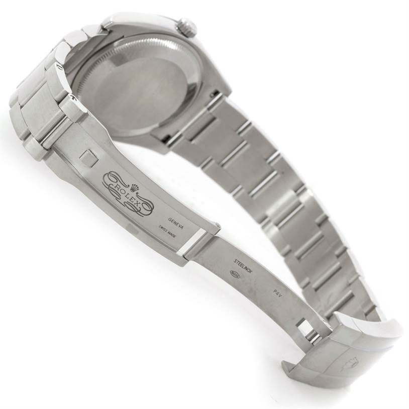 This image shows the Rolex Air-King 114200 Men's Stainless Steel Silver Dial 114200 Men's Stainless Steel Silver Dial watch from a side angle, highlighting the open clasp and bracelet.