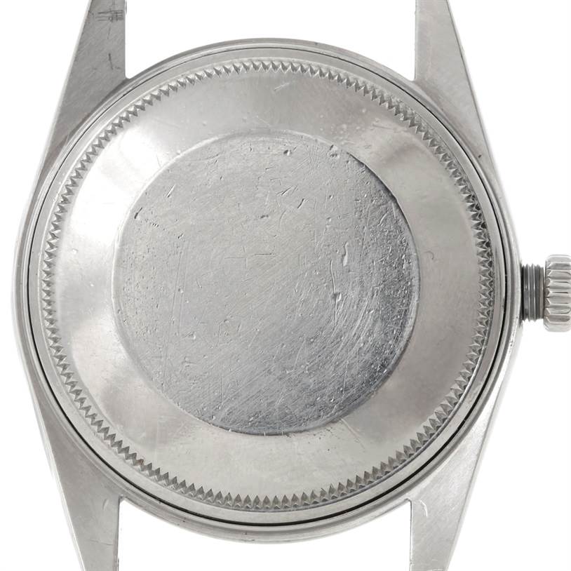 The image shows the back case and crown of the Rolex Air-King 5700 Men's Stainless Steel Black Dial 5700 Men's Stainless Steel Black Dial watch from a top-down angle.