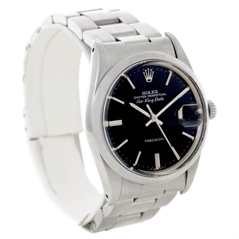 The image shows a Rolex Air-King 5700 Men's Stainless Steel Black Dial 5700 Men's Stainless Steel Black Dial watch with a stainless steel bracelet, black dial, and date magnifier at an angled side view.