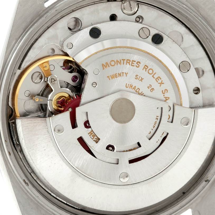 This image shows the internal mechanism of a Rolex Air-King 5700 Men's Stainless Steel Black Dial 5700 Men's Stainless Steel Black Dial watch viewed from the back, displaying the rotor and various components of the movement.
