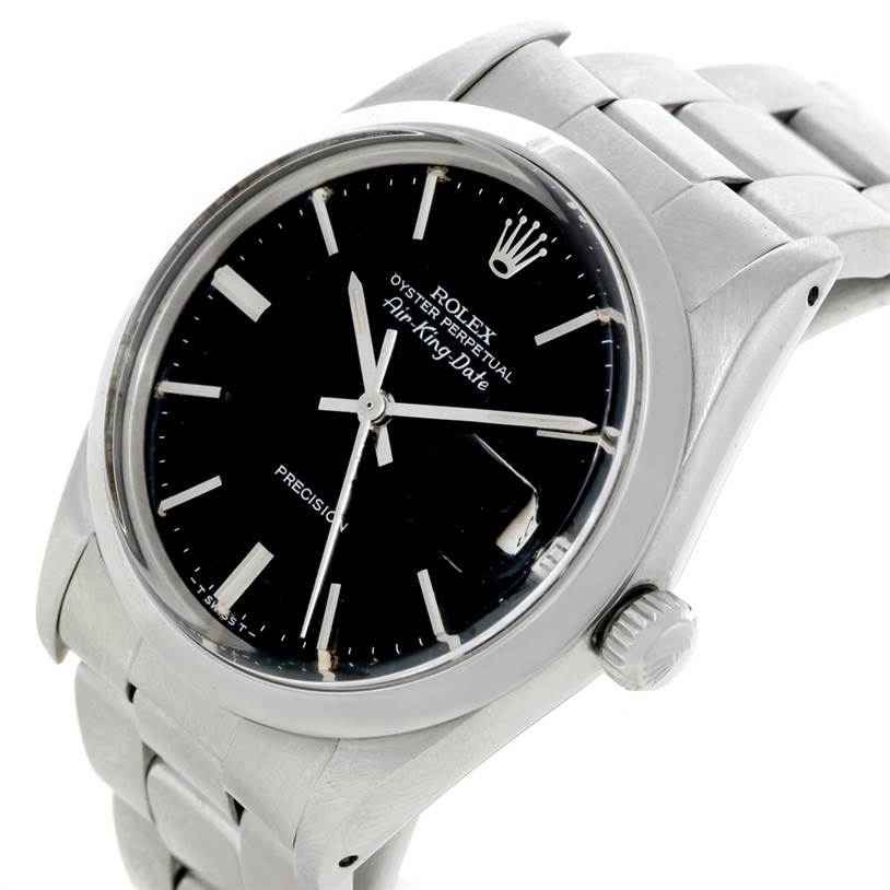 The image shows a close-up angled view of the Rolex Air-King 5700 Men's Stainless Steel Black Dial 5700 Men's Stainless Steel Black Dial watch featuring its dial, bezel, crown, and part of the metal strap.