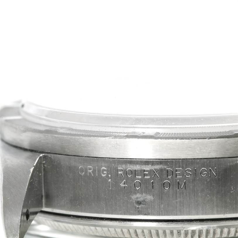 The image shows a close-up side view of the case and bezel of the Rolex Air-King 14010 Men's Stainless Steel Silver Dial 14010 Men's Stainless Steel Silver Dial, displaying the engraving "ORIG. ROLEX DESIGN 14010M."