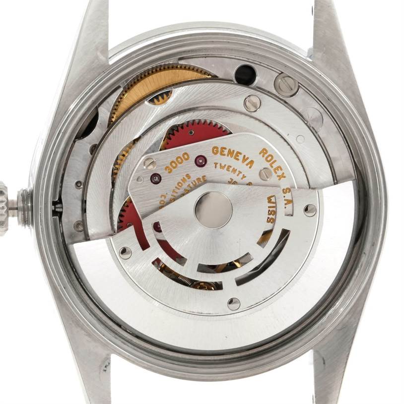 This image shows a close-up, rear view of the internal mechanisms of the Rolex Air-King 14010 Men's Stainless Steel Black Dial 14010 Men's Stainless Steel Black Dial watch.