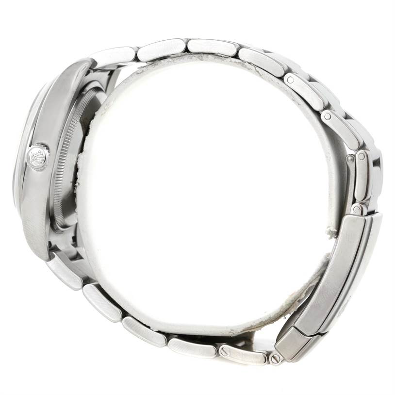 Side angle view of a Rolex Air-King 114200 Men's Stainless Steel Blue Dial 114200 Men's Stainless Steel Blue Dial showing the case, crown, and metal bracelet.