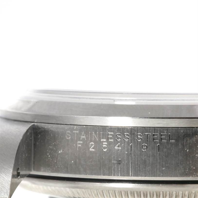 This image shows a close-up side view of a stainless steel case with engraving from an Air-King model Rolex watch.