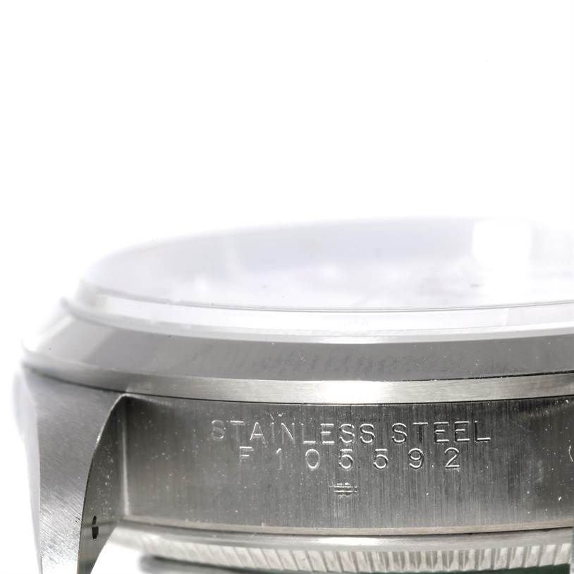 The image shows a close-up side view of the Rolex Air-King 14000 Men's Stainless Steel White Dial 14000 Men's Stainless Steel White Dial watch case, highlighting the stainless steel material and serial number.