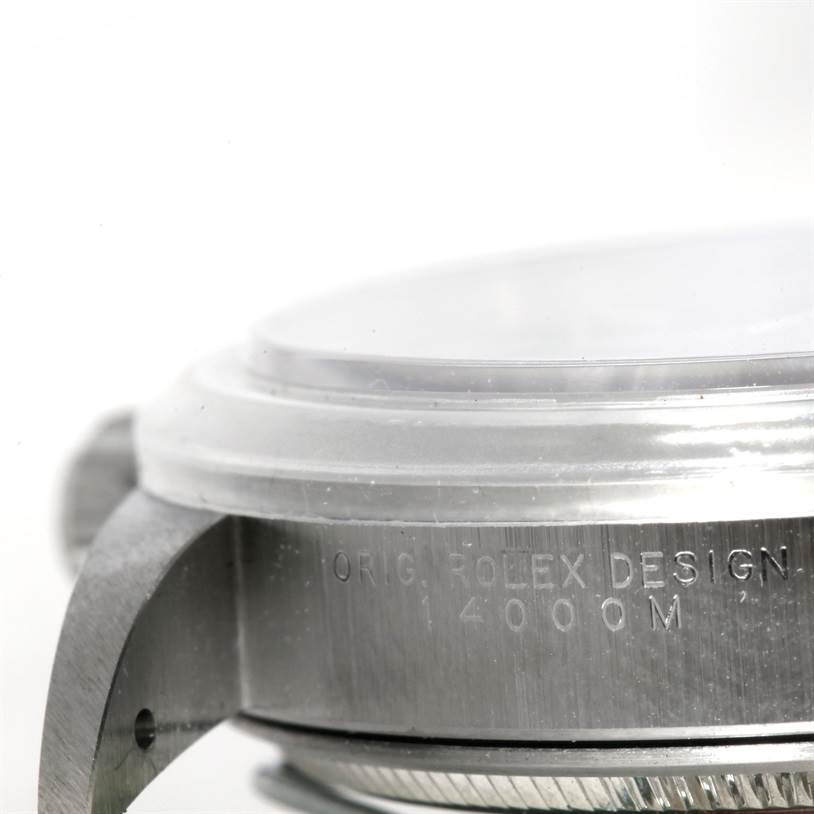 The image shows a close-up of the side and partial bezel of a Rolex Air-King 14000 Men's Stainless Steel Blue Dial 14000 Men's Stainless Steel Blue Dial watch with engraved text.