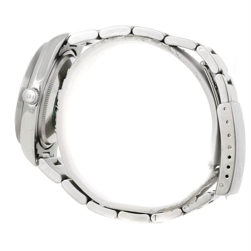 The image shows a side view of a Rolex Air-King 14010 Men's Stainless Steel White Dial 14010 Men's Stainless Steel White Dial watch focusing on its case, crown, and bracelet.