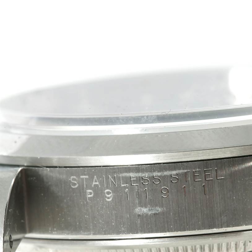 This close-up image shows the side view of the stainless steel case of a Rolex Air-King 14000 Men's Stainless Steel Blue Dial 14000 Men's Stainless Steel Blue Dial watch.