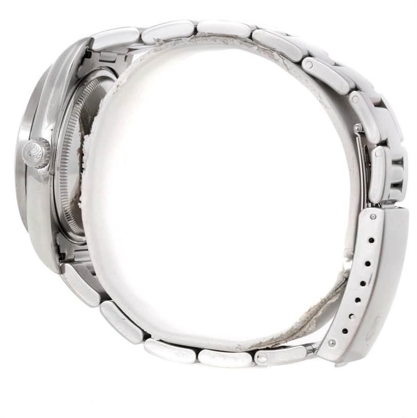 The image shows a side view of the Rolex Air-King 14010 Men's Stainless Steel Blue Dial 14010 Men's Stainless Steel Blue Dial watch, highlighting its clasp, bracelet, and case.