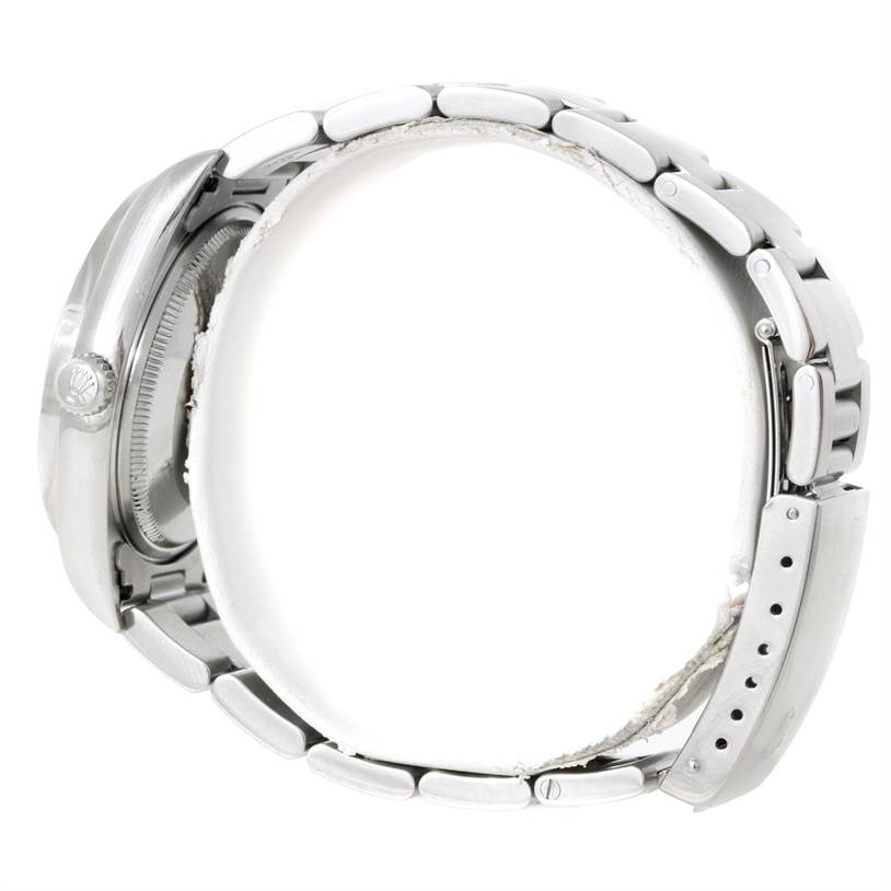 This image shows a side view of the Rolex Air-King 14010 Men's Stainless Steel Blue Dial 14010 Men's Stainless Steel Blue Dial watch, highlighting the case, crown, and metal bracelet.