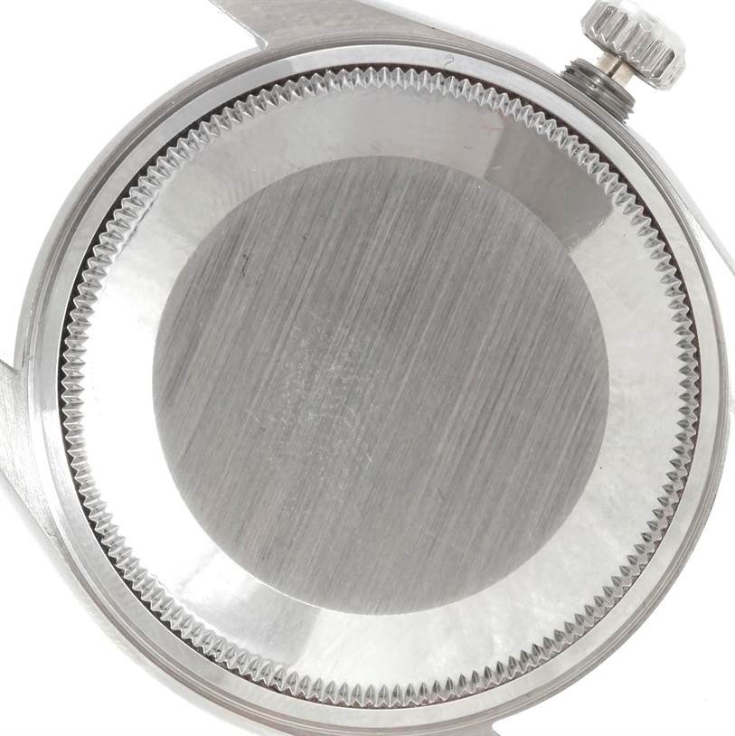 The image shows the back case and crown of a Rolex Air-King 14010 Men's Stainless Steel Blue Dial 14010 Men's Stainless Steel Blue Dial watch at a top-down angle.