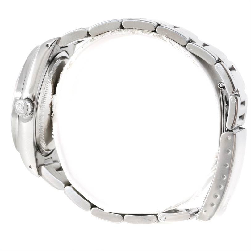 The image shows a side view of the Rolex Air-King 14010 Men's Stainless Steel Blue Dial 14010 Men's Stainless Steel Blue Dial watch, highlighting the crown, case, and part of the bracelet.