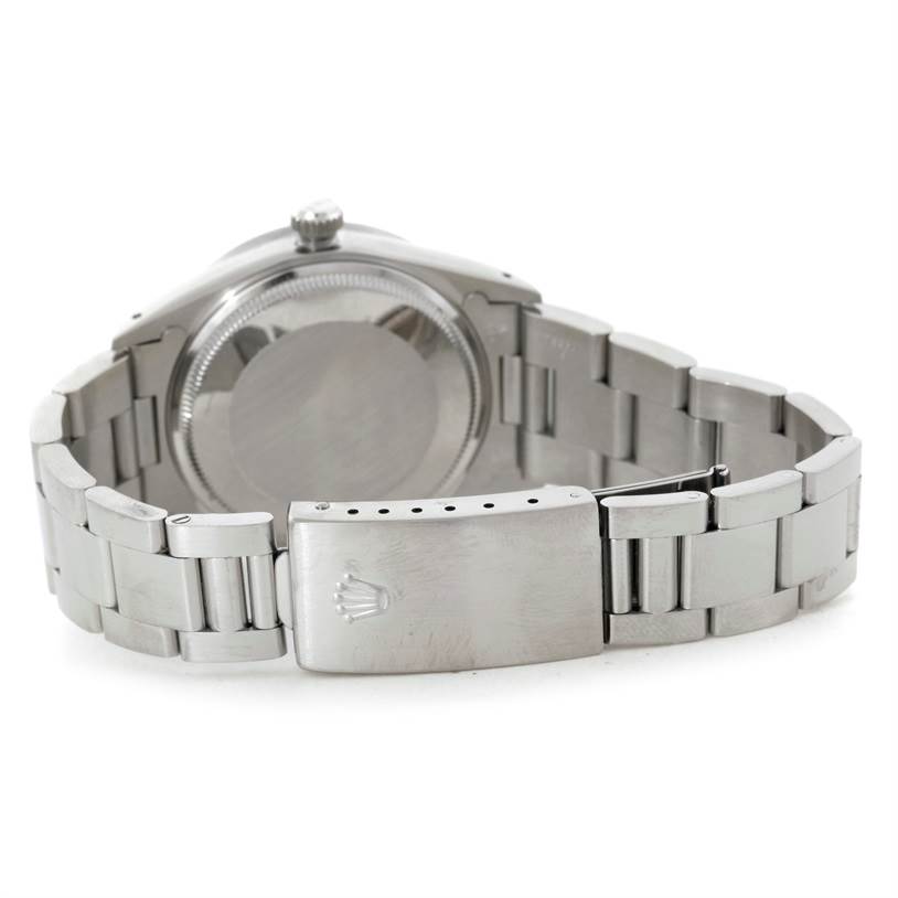 The image shows the back view of a Rolex Air-King 14010 Men's Stainless Steel Blue Dial 14010 Men's Stainless Steel Blue Dial watch, focusing on the case back and the stainless steel bracelet with the clasp.