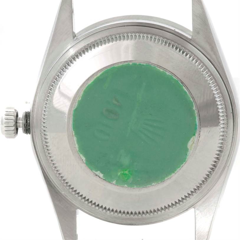 This image shows the back of a Rolex Air-King 14010 Men's Stainless Steel Blue Dial 14010 Men's Stainless Steel Blue Dial watch, featuring the screw-down case back and crown.