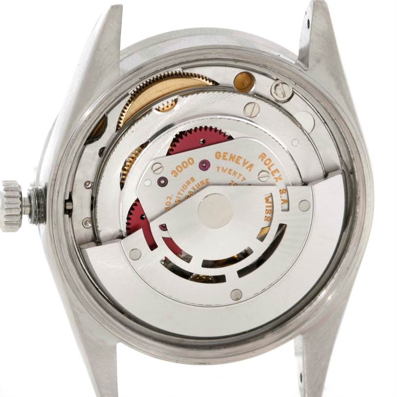 The image shows the back of a Rolex Air-King 14010 Men's Stainless Steel Blue Dial 14010 Men's Stainless Steel Blue Dial watch, highlighting its exposed movement and internal mechanisms.