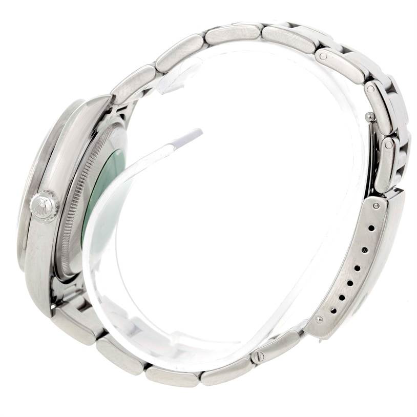 The image shows a side view of a Rolex Air-King 14010 Men's Stainless Steel Blue Dial 14010 Men's Stainless Steel Blue Dial watch, featuring its crown, case back, and bracelet with visible adjustment holes.