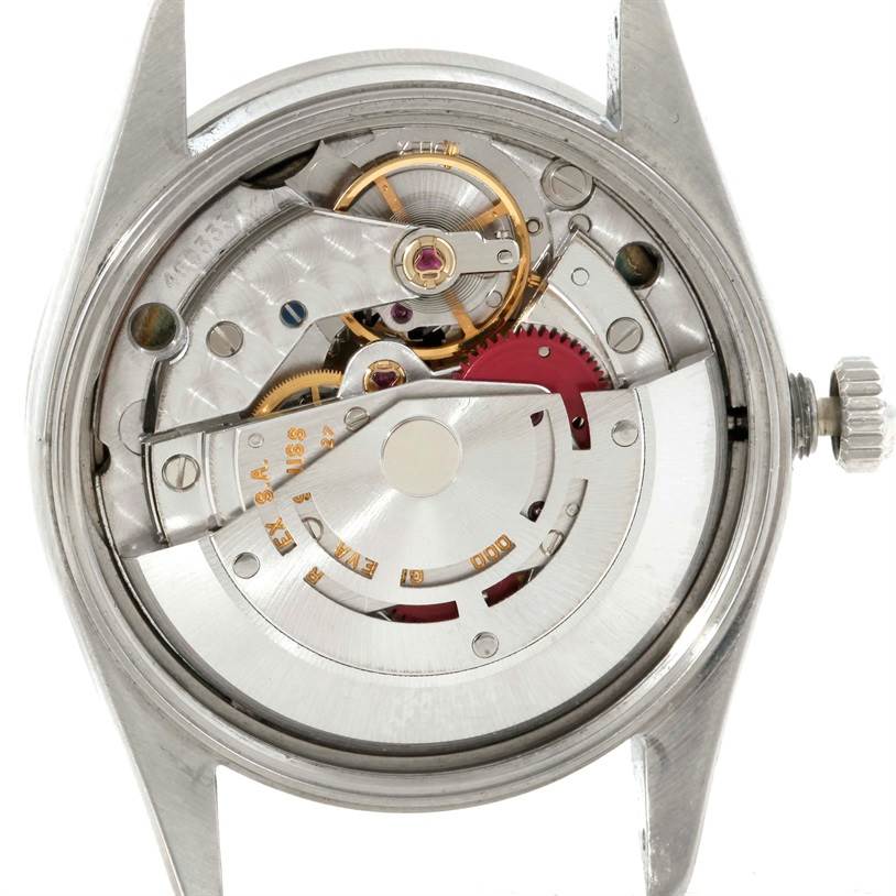 This image shows the inner mechanism of a Rolex Air-King 14010 Men's Stainless Steel Black Dial 14010 Men's Stainless Steel Black Dial watch from the back, highlighting gears and the rotor.