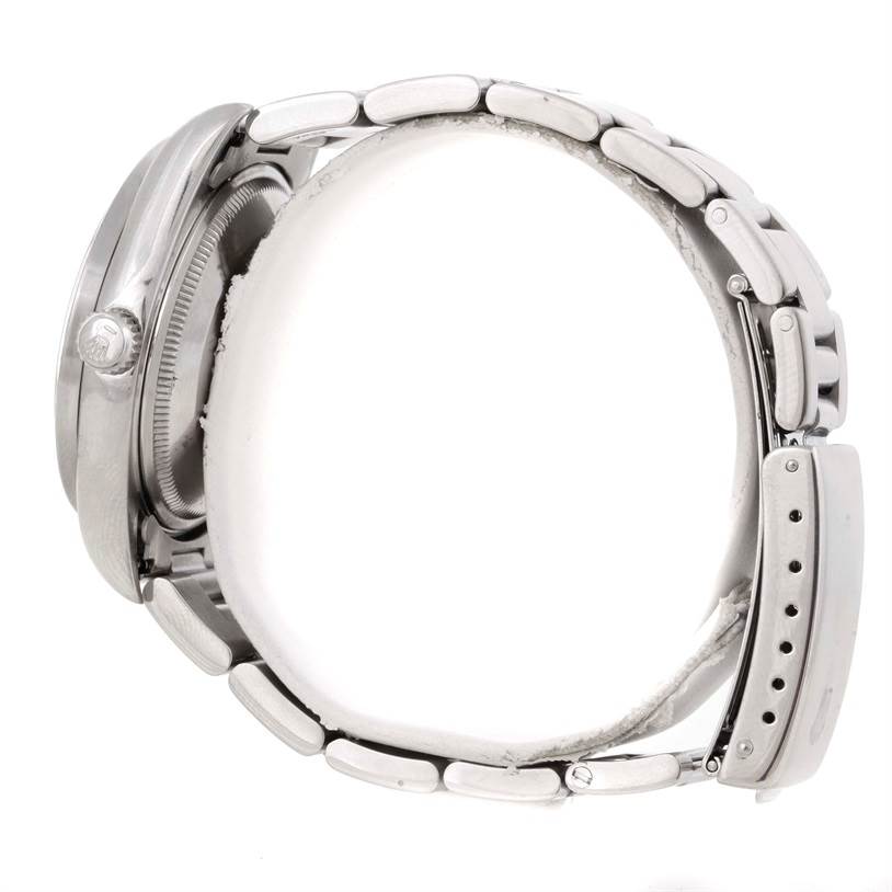 The image shows the Rolex Air-King 14010 Men's Stainless Steel Black Dial 14010 Men's Stainless Steel Black Dial watch from a side angle, emphasizing the case, crown, and bracelet with clasp.