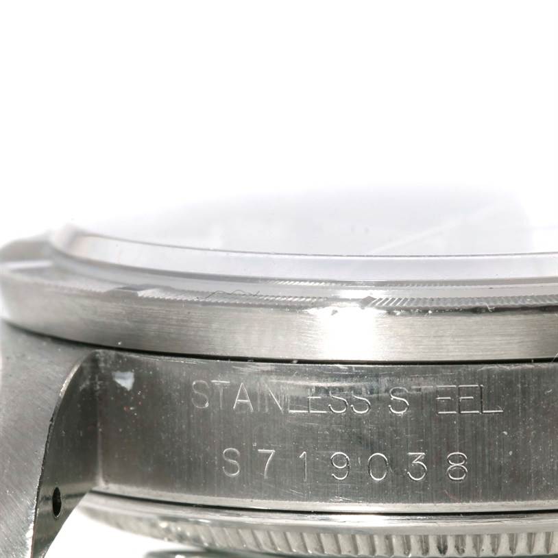 This image shows a close-up of the side of the Rolex Air-King 14010 Men's Stainless Steel Black Dial 14010 Men's Stainless Steel Black Dial model, highlighting the stainless steel case and serial number.