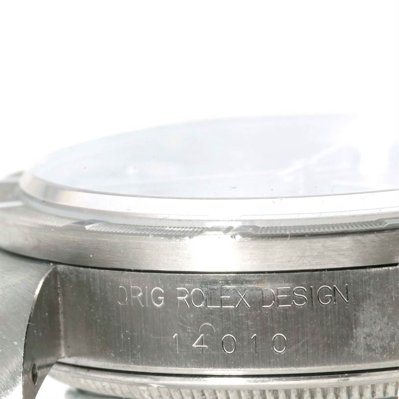 The image shows a close-up of the Rolex Air-King 14010 Men's Stainless Steel Black Dial 14010 Men's Stainless Steel Black Dial watch bezel and engraved watch case.