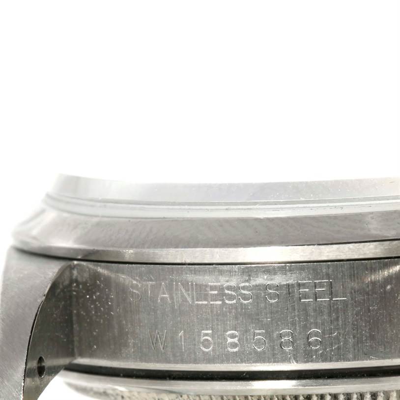 This close-up image of a Rolex Air-King 14000 Men's Stainless Steel Pink Dial 14000 Men's Stainless Steel Pink Dial watch shows the side of the stainless steel case with its engraved serial number.
