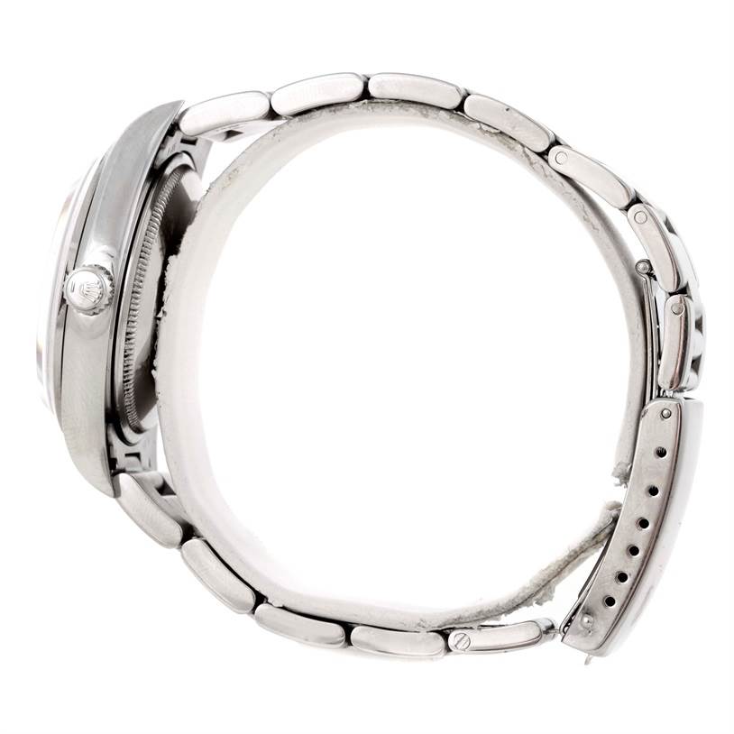 The image shows a side view of the Rolex Air-King 14000 Men's Stainless Steel Pink Dial 14000 Men's Stainless Steel Pink Dial watch, highlighting the crown, case, and metal bracelet.