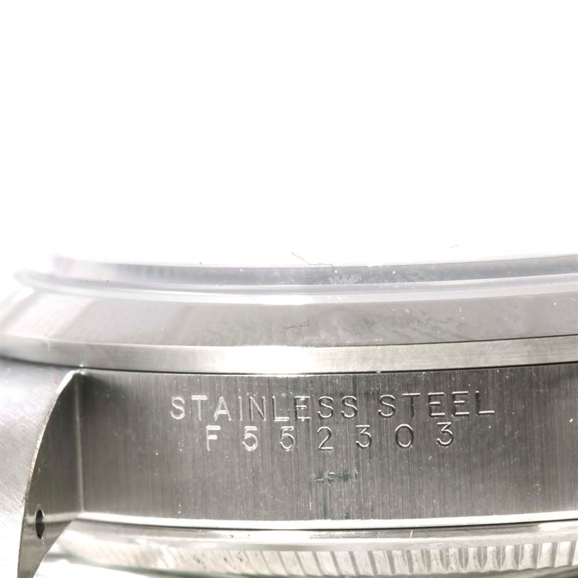 The image shows a close-up view of the stainless steel case and part of the bezel of the Rolex Air-King 14000 Men's Stainless Steel Blue Dial 14000 Men's Stainless Steel Blue Dial watch, highlighting the serial number.