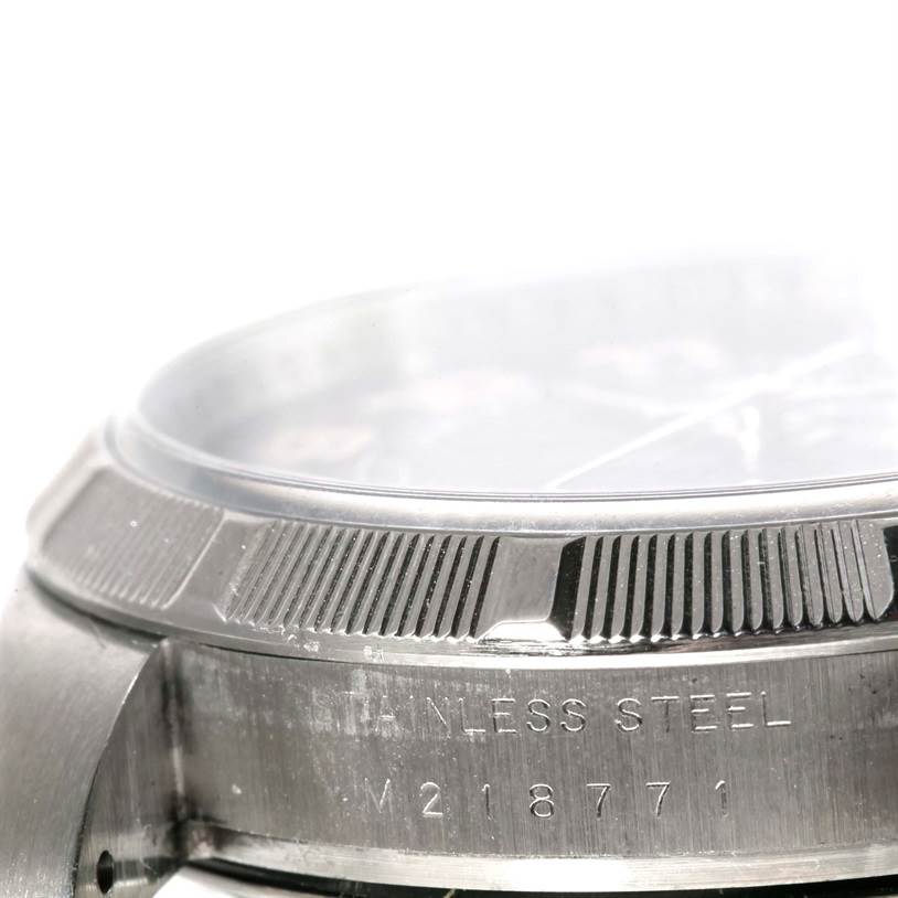 The image shows a close-up side view of the bezel and casing of a Rolex Air-King 114210 Men's Stainless Steel Blue Dial 114210 Men's Stainless Steel Blue Dial watch.