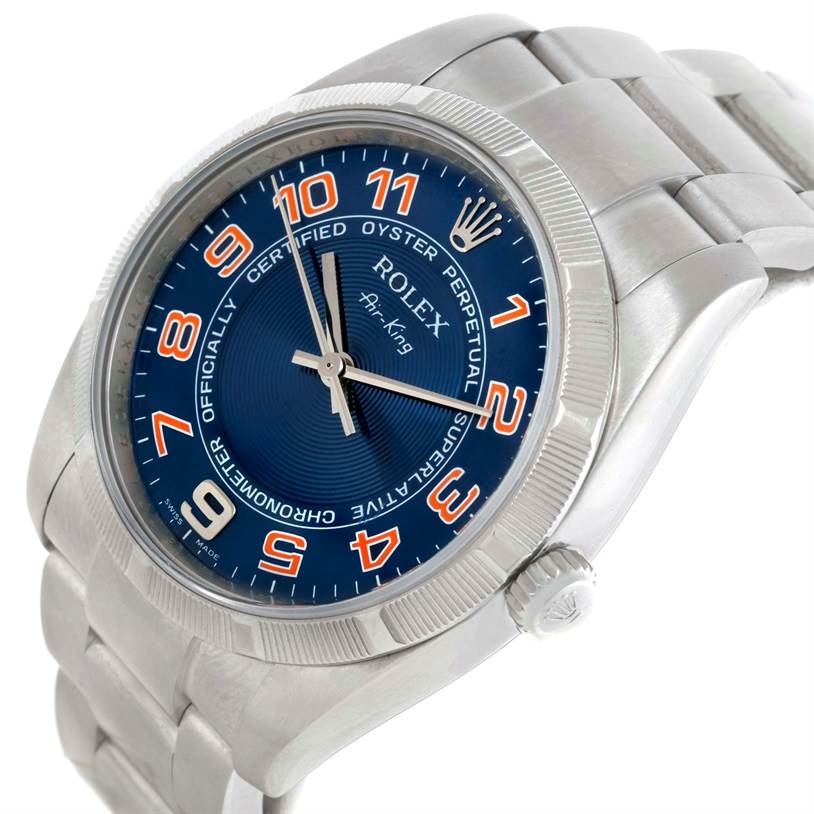 The Rolex Air-King 114210 Men's Stainless Steel Blue Dial 114210 Men's Stainless Steel Blue Dial watch is shown at a slightly angled top-down view, highlighting its blue dial, bezel, and part of the bracelet.