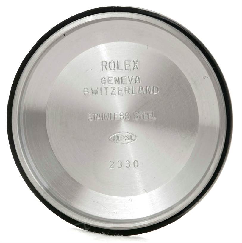 This is the inside view of the case back for a Rolex Air-King 114210 Men's Stainless Steel Blue Dial 114210 Men's Stainless Steel Blue Dial watch, showing engraved text and the model number.