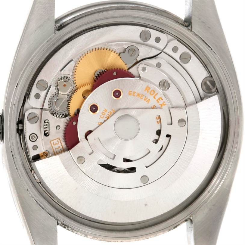 This image shows the internal mechanism of a Rolex Air-King 114210 Men's Stainless Steel Blue Dial 114210 Men's Stainless Steel Blue Dial watch from a rear view, focusing on the movement parts.