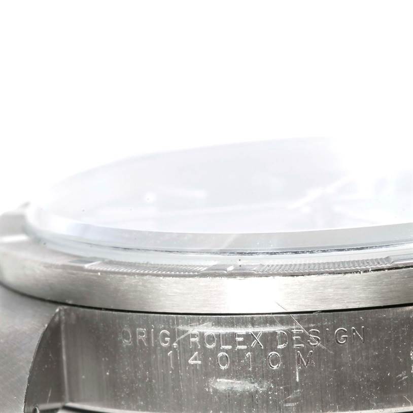 This image shows a side view of the case and bezel of a Rolex Air-King 14010 Men's Stainless Steel Black Dial 14010 Men's Stainless Steel Black Dial watch, with visible engraving.