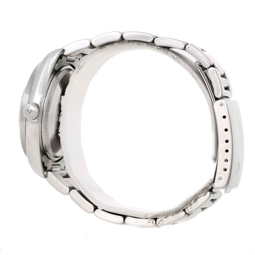 The image shows a side view of a Rolex Air-King 14010 Men's Stainless Steel Black Dial 14010 Men's Stainless Steel Black Dial watch, highlighting its case, crown, and bracelet links.